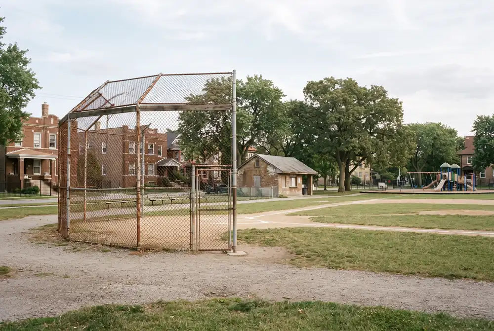 Neighborhood park with a fieldhouse and ball field in Hermosa, Chicago