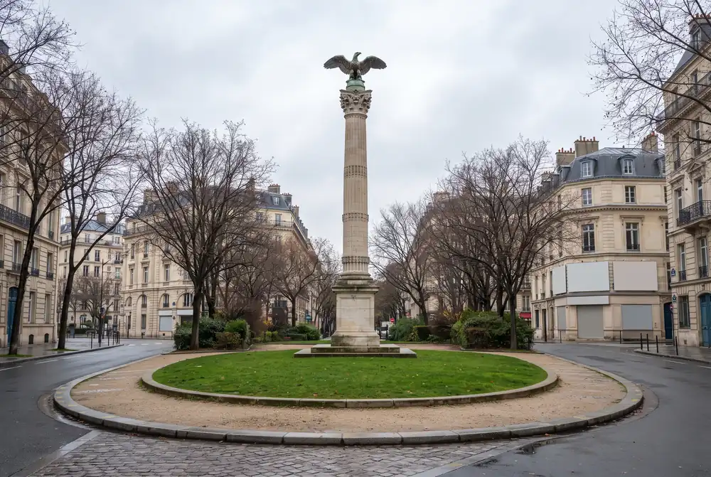 Tall stone column monument on a boulevard square in Logan Square, Chicago